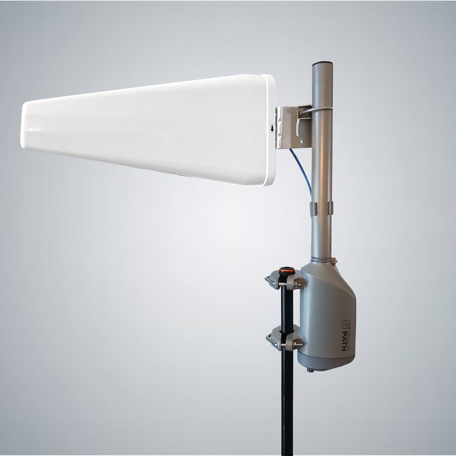 A SOCA rotator clamped to a mast, carrying a log periodic directional antenna, photographed against a plain studio background.
